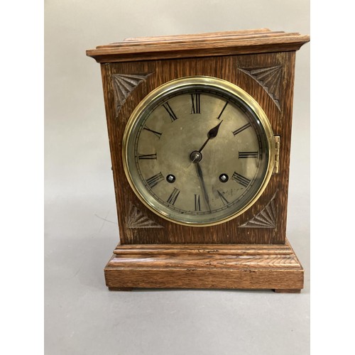 191 - An oak cased clock having a brass dial with Roman numerals and an eight day movement, 21cm wide x 27... 