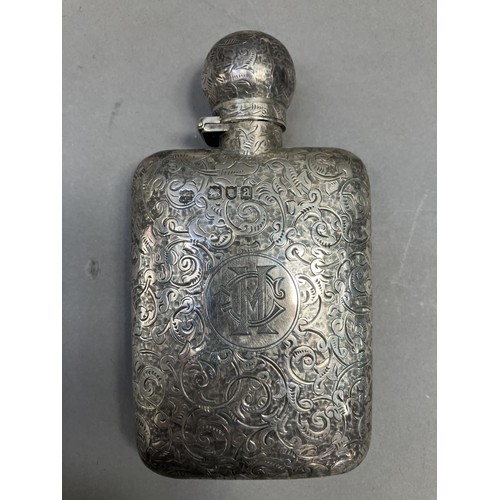 243 - A Victorian silver spirit flask, chased with all-over foliate scrolls, monogram 'cm' to cartouche, L... 