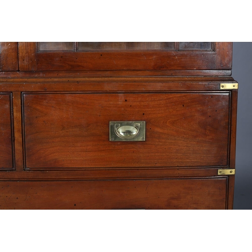 94 - Kennedy of Ipswich, a walnut and brass bound campaign bookcase-chest retailed by Harrods, having two... 