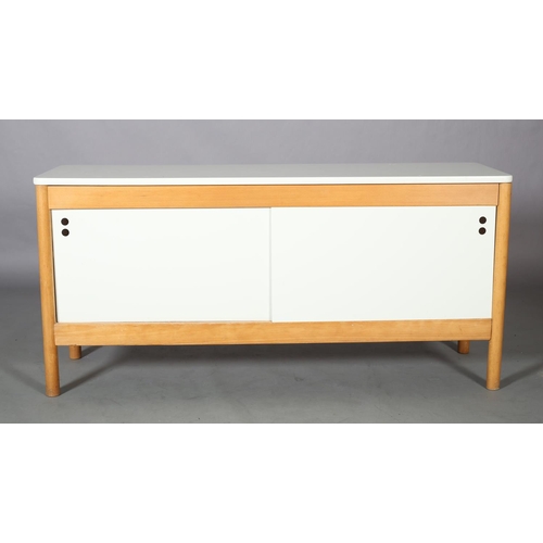 119 - A beech and white sideboard, having two sliding doors, fitted with one shelf, on rounded legs, 151cm... 