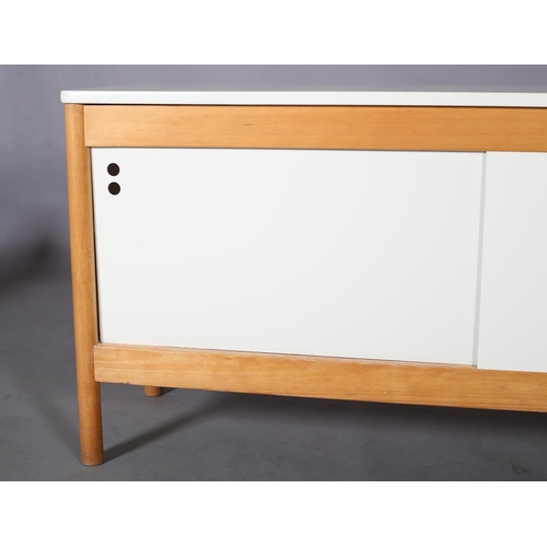 119 - A beech and white sideboard, having two sliding doors, fitted with one shelf, on rounded legs, 151cm... 