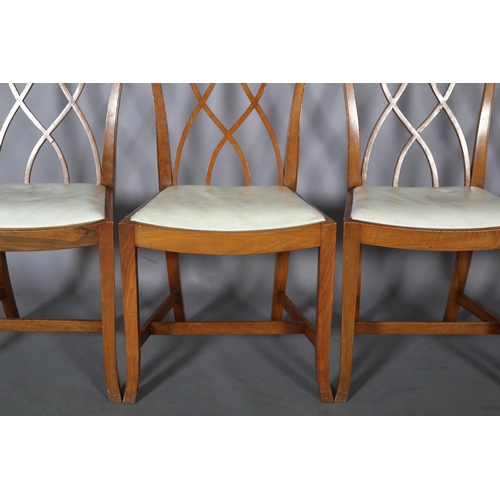 106 - Heals of London, A set of four walnut dining chairs, arched top rail over interlaced back, off-white... 