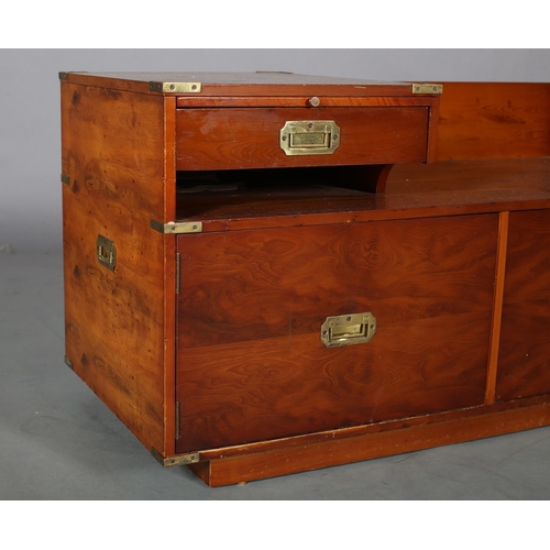 102 - A yew-wood and brass bound 'Chippy' telephone table with seat, pull out formica lined slide, drawer,... 