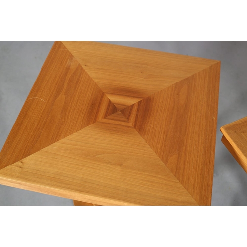 95 - R Griffith Woodwear Ltd, Wychwood Design, a pair of walnut lamp tables, of square outline, quarter v... 