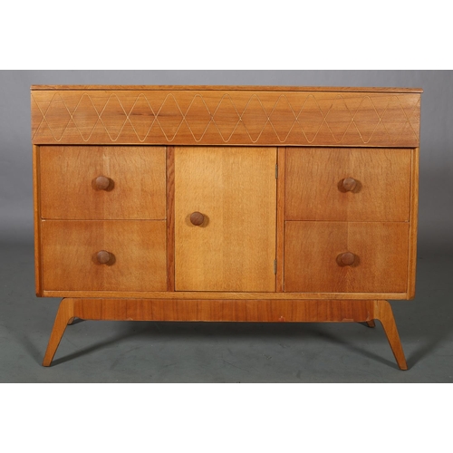 114 - An oak and walnut veneered cabinet having a frieze drawer with incised running wave band design, ove... 