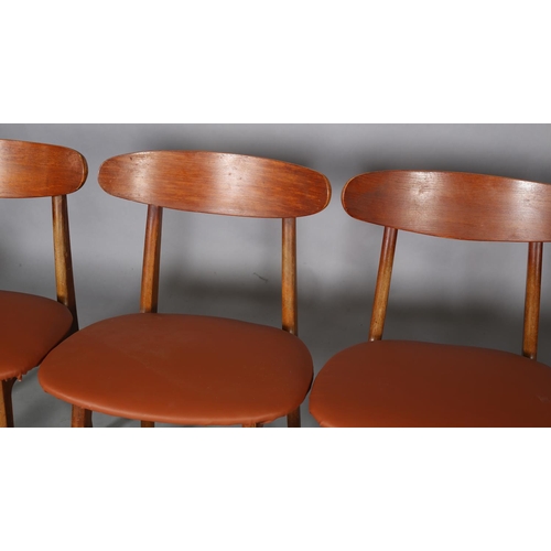 75 - A set of four Danish teak dining chairs, c1960s, in the style of Hans Wegner, having a curved bar to... 