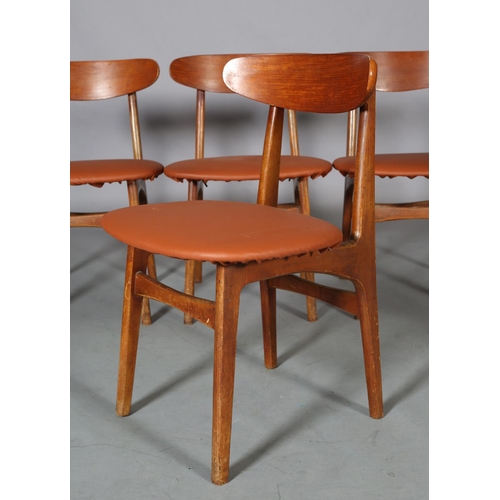 75 - A set of four Danish teak dining chairs, c1960s, in the style of Hans Wegner, having a curved bar to... 