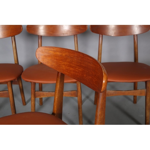 75 - A set of four Danish teak dining chairs, c1960s, in the style of Hans Wegner, having a curved bar to... 