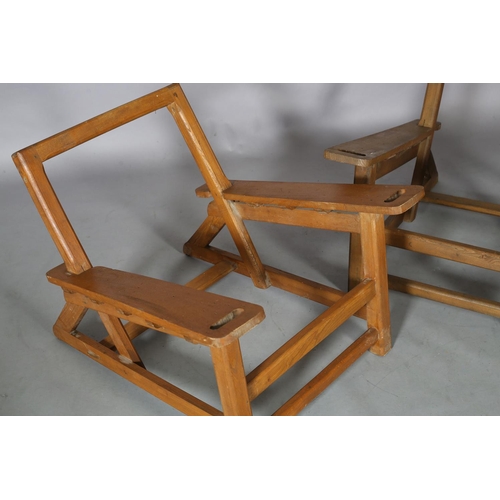 131 - A pair of elm armchair frames, c1940s, low rectangular back, broad tapered arms with finger grip, on... 