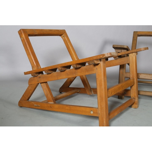 131 - A pair of elm armchair frames, c1940s, low rectangular back, broad tapered arms with finger grip, on... 