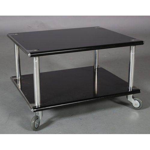 26 - A chrome and black two tier stand or table, rectangular, on castors, 60cm wide x 50cm deep x 38cm hi... 