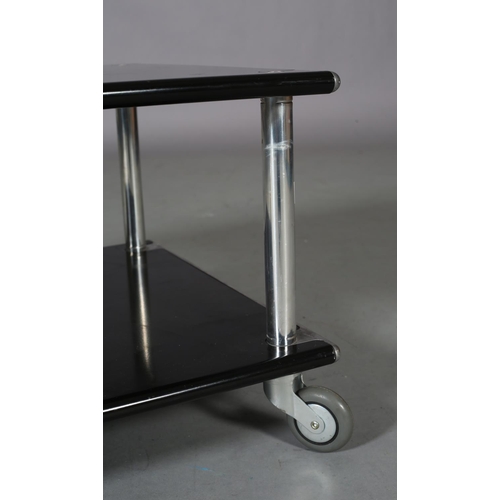 26 - A chrome and black two tier stand or table, rectangular, on castors, 60cm wide x 50cm deep x 38cm hi... 