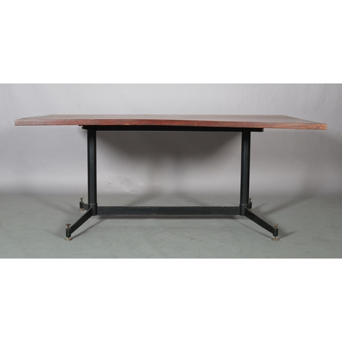 60 - An Italian walnut dining table c1960s on metal twin pedestal joined by a stretcher and on splayed fe... 