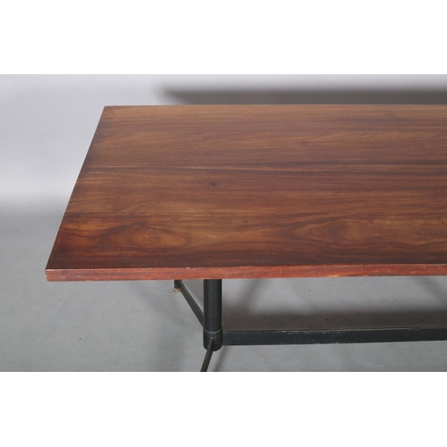 60 - An Italian walnut dining table c1960s on metal twin pedestal joined by a stretcher and on splayed fe... 