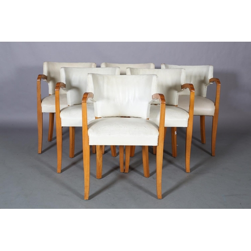 107 - A set of six Art Deco walnut and cream leather club chairs, with tub-shaped back, on square tapered ... 