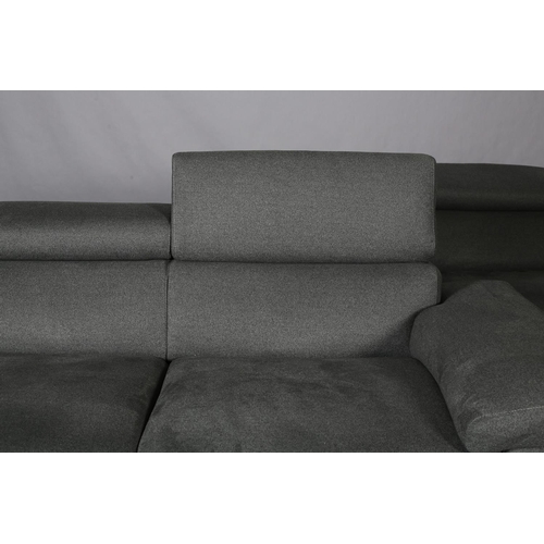 116 - Natuzzi Editions, Italy, a pair of sofas upholstered in pale grey fabric, with adjustable headrest, ... 