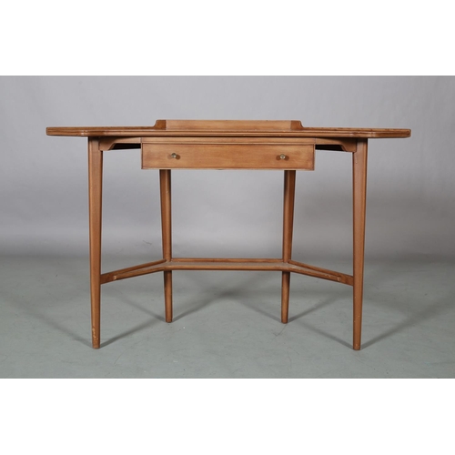 62 - A mahogany finish corner writing table, with gallery, drawer to apron, on rounded and tapered legs a... 