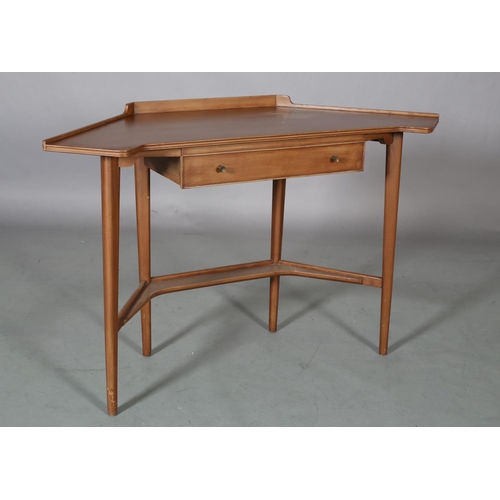 62 - A mahogany finish corner writing table, with gallery, drawer to apron, on rounded and tapered legs a... 