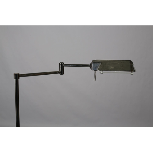 85 - A pair of French patinated nickel floor lamps with articulating heads, on telescopic columns, on cir... 