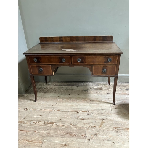 271 - An Edwardian mahogany side table with raised back having satinwood inlay above two long and two shor... 