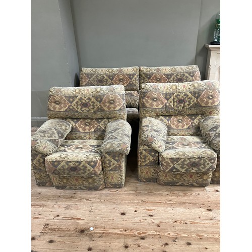 281 - A three seater sofa with two armchairs upholstered in Aztec style fabric