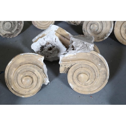 128 - A pair of painted wood Ionic columns with plaster capitals and stone bases column 260cm high, capita... 