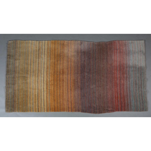 120 - Conran, A multi-coloured striped wool rug, in muted shades, 243cm x 172cm