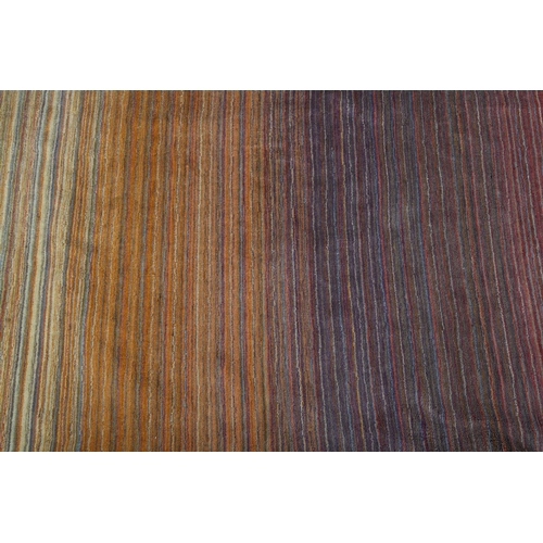 120 - Conran, A multi-coloured striped wool rug, in muted shades, 243cm x 172cm