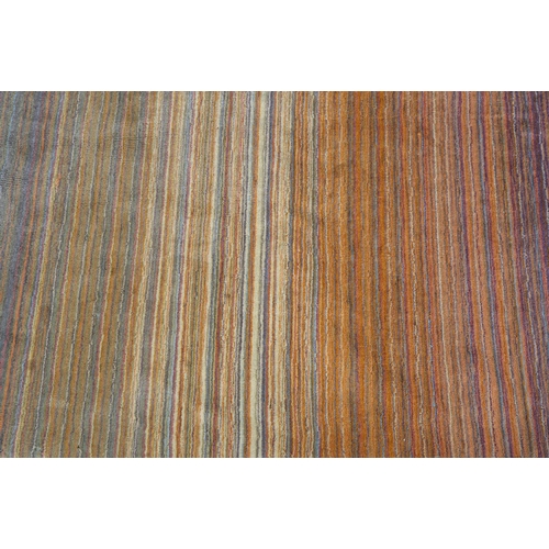 120 - Conran, A multi-coloured striped wool rug, in muted shades, 243cm x 172cm