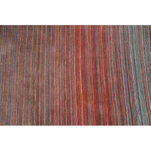 120 - Conran, A multi-coloured striped wool rug, in muted shades, 243cm x 172cm