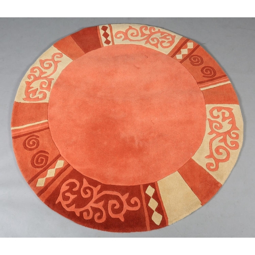 121 - Theo Keller for TheKo Harmony, a circular wool rug in shades of salmon pink terracotta and sand, 150... 