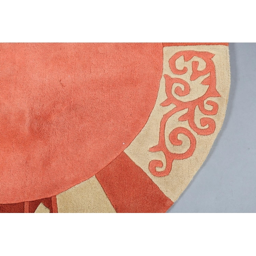 121 - Theo Keller for TheKo Harmony, a circular wool rug in shades of salmon pink terracotta and sand, 150... 