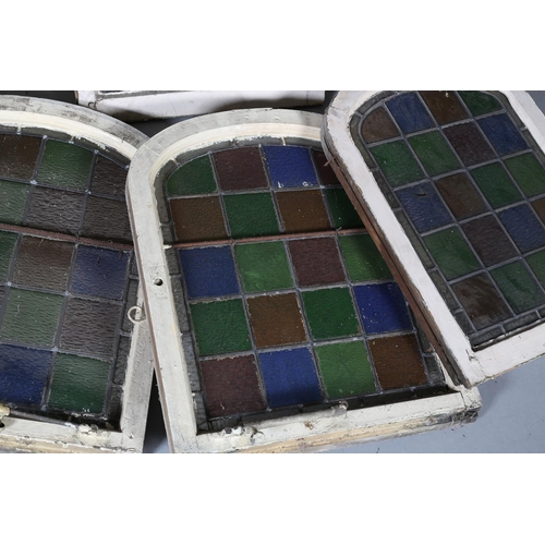 125 - A set of six colour stain glass leaded windows in arched frames, c1890, each 69cm x 52cm