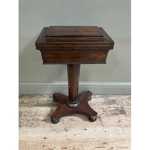 322 - A late Regency rosewood work table interior lined with turquoise silk on a tapered  octagonal column... 