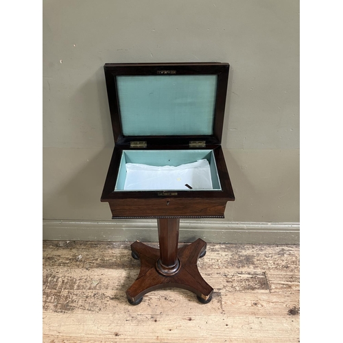 322 - A late Regency rosewood work table interior lined with turquoise silk on a tapered  octagonal column... 