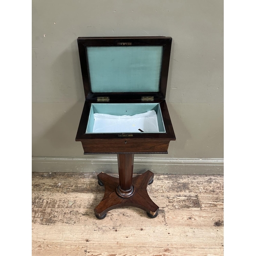 322 - A late Regency rosewood work table interior lined with turquoise silk on a tapered  octagonal column... 