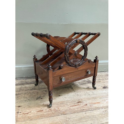 324 - A 19th Century mahogany canterbury of X frame and laurel wreath design with three divisions above a ... 