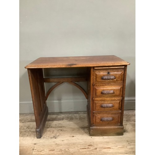 326 - Early 20th Century oak desk, knee hole flanked with a single pedestal with a pull slide and four dra... 