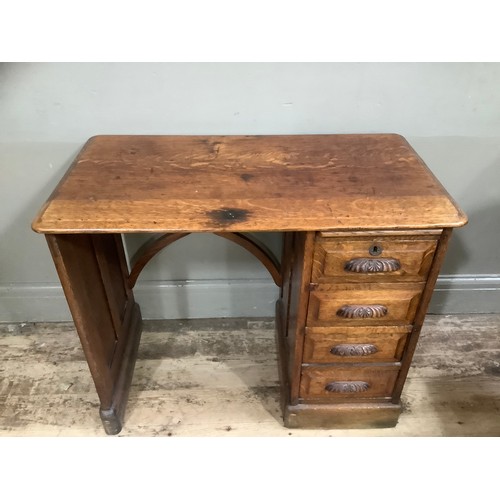 326 - Early 20th Century oak desk, knee hole flanked with a single pedestal with a pull slide and four dra... 