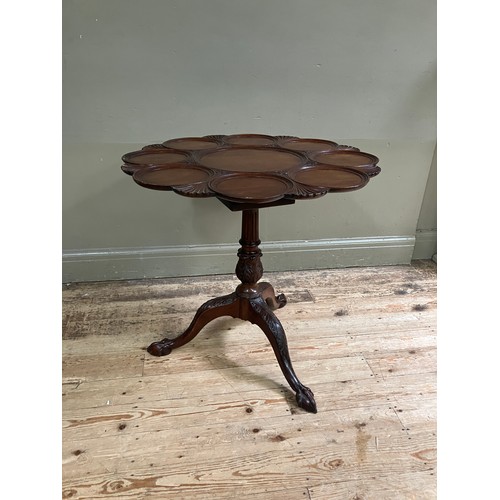 330 - An 18th century style mahogany supper table, the circular snap top of scalloped outline revolving on... 