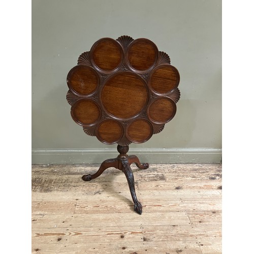 330 - An 18th century style mahogany supper table, the circular snap top of scalloped outline revolving on... 