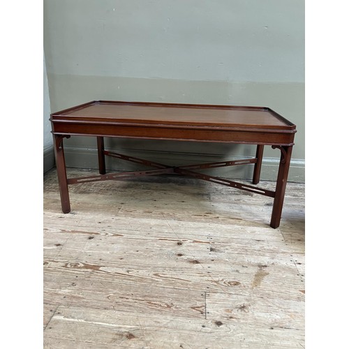 332 - A mahogany occasional table by Arthur Brett and Sons of Norwich, rectangular with canted corners, pi... 