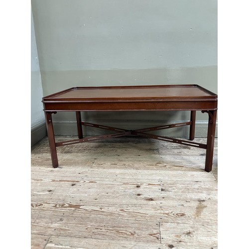 332 - A mahogany occasional table by Arthur Brett and Sons of Norwich, rectangular with canted corners, pi... 