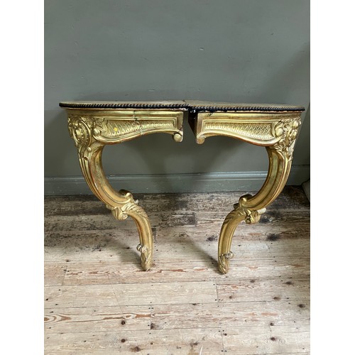 313 - A pair of 18th Century style gilt wood  corner console tables with fabric lined surfaces