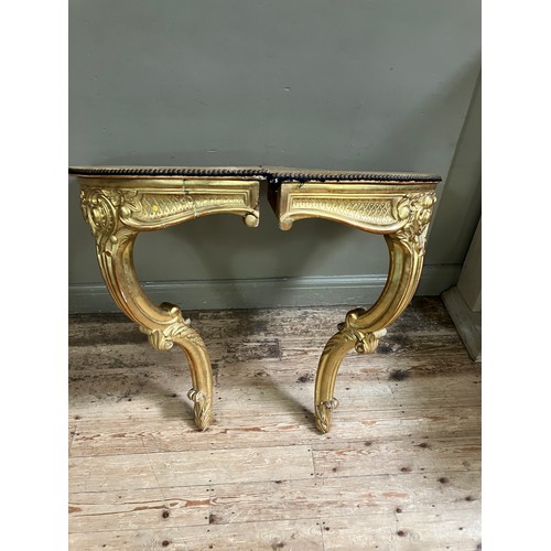 313 - A pair of 18th Century style gilt wood  corner console tables with fabric lined surfaces