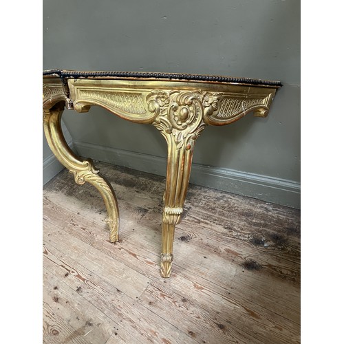 313 - A pair of 18th Century style gilt wood  corner console tables with fabric lined surfaces