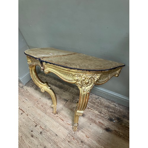 313 - A pair of 18th Century style gilt wood  corner console tables with fabric lined surfaces