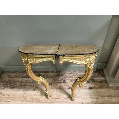 313 - A pair of 18th Century style gilt wood  corner console tables with fabric lined surfaces