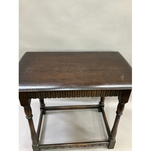 335 - An Ercol style dark stained rectangular occasional table