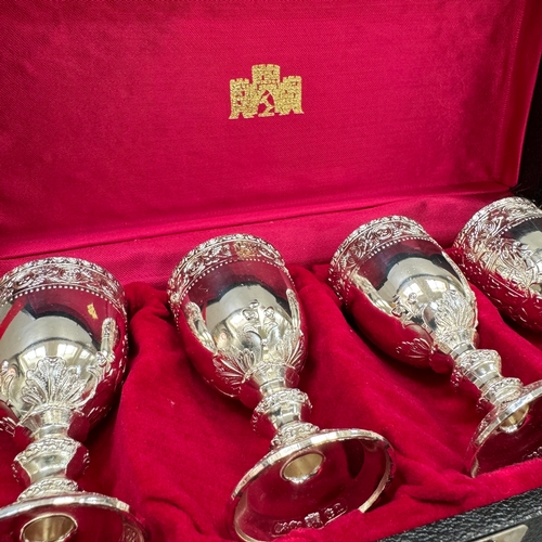 106 - Two cased commemorative sets of etched glasses and a plated set